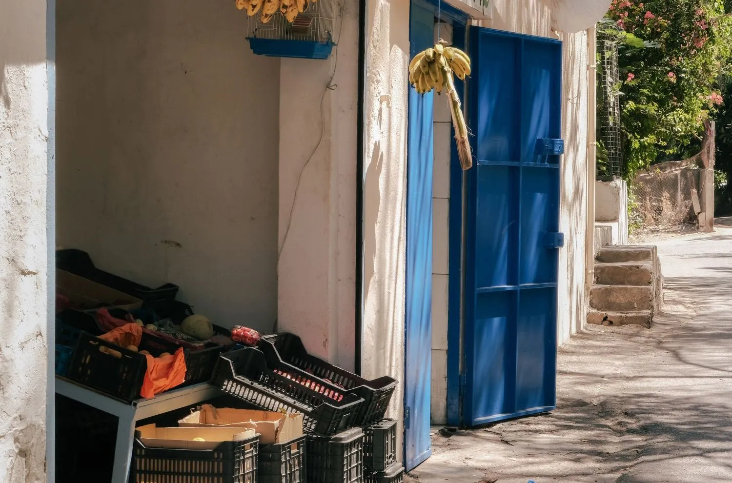 A small Beirut shop entrance with produce crates